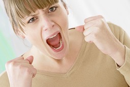 Photo of an angry woman yelling